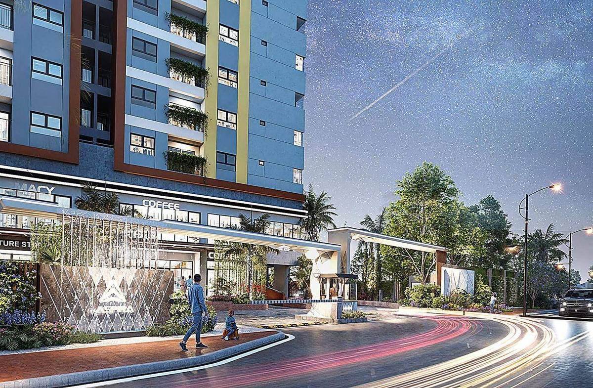 Mặt tiền The Aspira về đêm với cổng chào Zen Arc